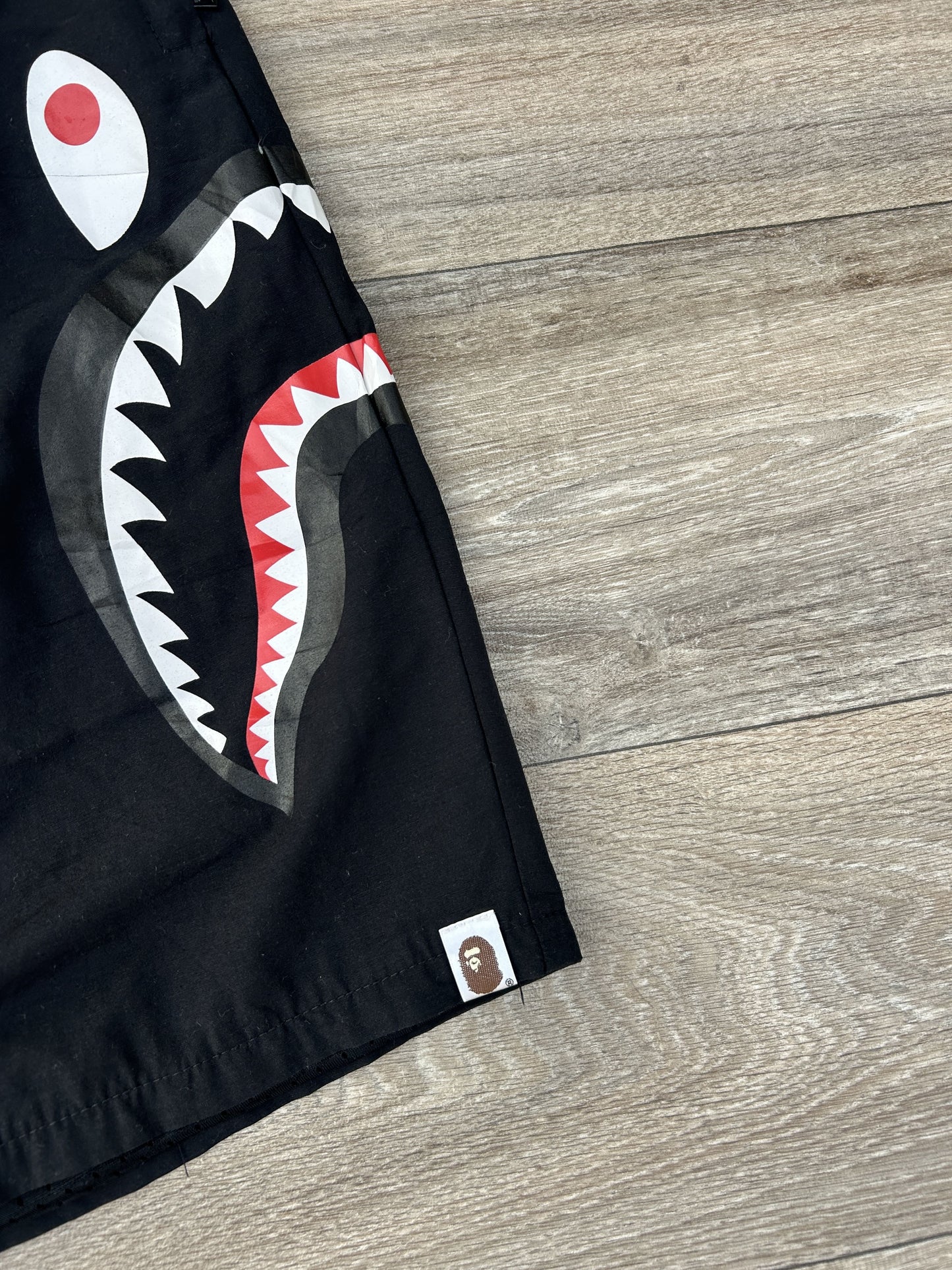 Bape shark logo print shorts