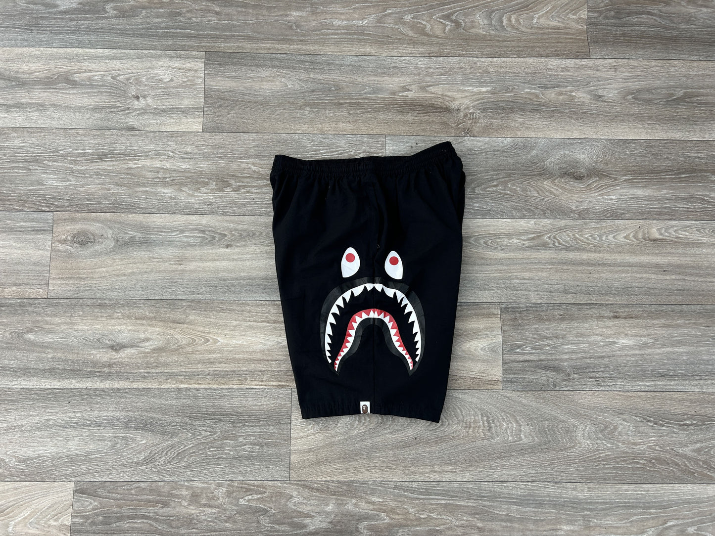 Bape shark logo print shorts