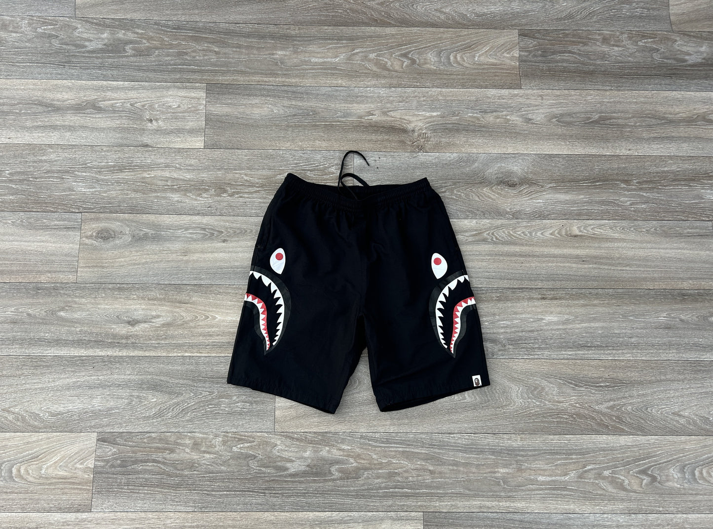 Bape shark logo print shorts